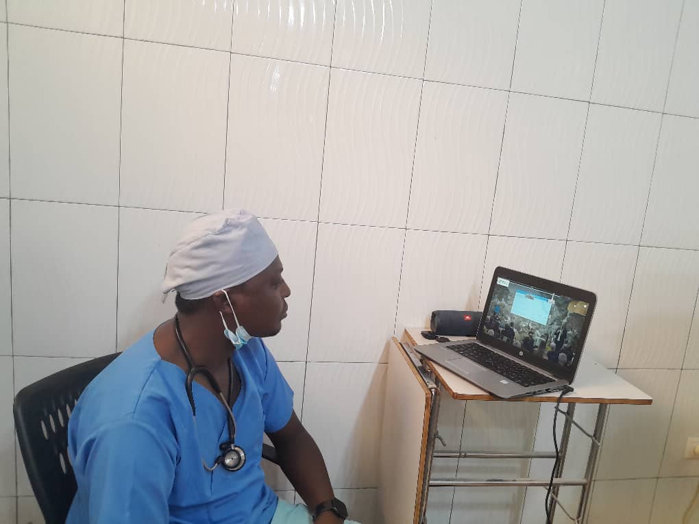 Healthcare professional remotely attending Dr. Xavier Raingeval&apos;s demonstration at WDRAPM 2025.